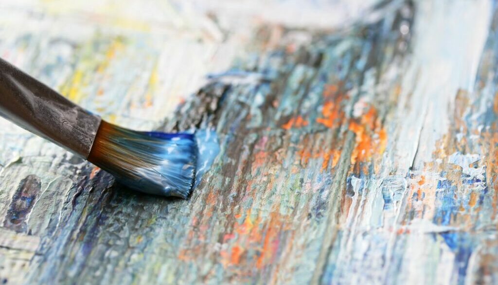 a close up of a paint brush on canvas